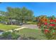 Lush front yard featuring a view of a neighborhood lake and flowers, plus off-street parking at 107 Amaranth Ave, Summerville, SC 29483