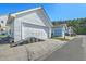 Exterior of a two car garage with an inclined driveway for easy access at 107 Amaranth Ave, Summerville, SC 29483