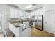 Modern kitchen with granite countertops, stainless steel appliances, and ample white cabinetry at 107 Amaranth Ave, Summerville, SC 29483