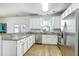 Well-lit kitchen features stainless appliances, granite countertops, and ample white cabinetry at 107 Amaranth Ave, Summerville, SC 29483