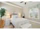 Bright bedroom features a comfortable bed, soft lighting, and a large window, creating a cozy and inviting space at 112 Starling St, Summerville, SC 29483