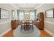 Elegant dining room with hardwood floors, wooden furniture, and plenty of natural light, perfect for Gathering gatherings at 112 Starling St, Summerville, SC 29483