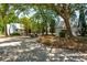 Charming white cottage with a golf cart parked nearby, exuding a relaxed and inviting atmosphere at 112 Starling St, Summerville, SC 29483
