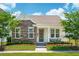Charming single-story home with a stone accent wall, well-manicured lawn and covered porch at 112 Starling St, Summerville, SC 29483