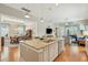 Granite island provides ample seating and prep space, overlooking the living and dining areas in an open layout at 112 Starling St, Summerville, SC 29483