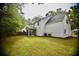 View of the home with spacious backyard and screened in porch at 1178 Braddock Ave, North Charleston, SC 29406