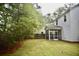 A well-maintained lawn compliments the white vinyl-sided home, with a peek at the screened in porch at 1178 Braddock Ave, North Charleston, SC 29406