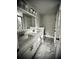 The bathroom features double sinks with a marble countertop, marble tile floor, and a separate glass door shower at 1178 Braddock Ave, North Charleston, SC 29406