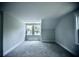 A bedroom space with carpet and a window bringing in natural light at 1178 Braddock Ave, North Charleston, SC 29406