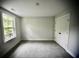 This bedroom features carpet and a window that provides natural light, as well as a closet for storage at 1178 Braddock Ave, North Charleston, SC 29406