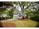 Charming two-story home with a manicured lawn and mature trees at 1178 Braddock Ave, North Charleston, SC 29406