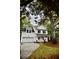 The charming two-story home features a classic white facade, attached garage, and beautiful landscaping at 1178 Braddock Ave, North Charleston, SC 29406
