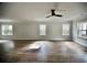 Bright living room with hardwood floors and large windows at 1178 Braddock Ave, North Charleston, SC 29406