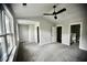 Bright primary bedroom with plush carpeting, ceiling fan, and an en-suite bathroom at 1178 Braddock Ave, North Charleston, SC 29406