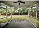 The screened porch provides an outdoor relaxation area with views of the backyard and overhead ceiling fan at 1178 Braddock Ave, North Charleston, SC 29406
