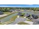 An aerial view of a beautiful home with lake views and a well-maintained yard in a desirable neighborhood at 118 Jesup Ct, Ridgeville, SC 29472