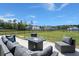 Cozy outdoor space featuring a modern fire pit and plush seating, perfect for entertaining at 118 Jesup Ct, Ridgeville, SC 29472