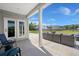 Relaxing back patio with comfortable seating and view of the community at 118 Jesup Ct, Ridgeville, SC 29472