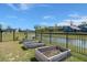 Backyard featuring a pond view and several raised wooden garden boxes at 118 Jesup Ct, Ridgeville, SC 29472