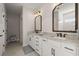 Elegant bathroom with dual sinks, granite counters, and modern fixtures at 118 Jesup Ct, Ridgeville, SC 29472