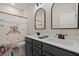 Charming bathroom featuring double sinks, modern fixtures, and fun shower curtain at 118 Jesup Ct, Ridgeville, SC 29472