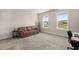 Spacious bedroom with large windows and a view of the backyard pond at 118 Jesup Ct, Ridgeville, SC 29472