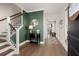 Elegant entryway with hardwood floors, a staircase, and decorative accents creating a warm and inviting atmosphere at 118 Jesup Ct, Ridgeville, SC 29472