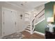 Elegant entryway with hardwood floors, a staircase, and decorative accents creating a warm and inviting atmosphere at 118 Jesup Ct, Ridgeville, SC 29472