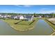 Charming home with a fenced yard, backing onto a serene lake, offering privacy and scenic views at 118 Jesup Ct, Ridgeville, SC 29472