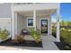 Inviting front porch with stylish seating, decorative plants, and a welcoming entrance at 118 Jesup Ct, Ridgeville, SC 29472