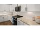 Bright kitchen with stainless steel appliances, granite countertops, white cabinets, and tile backsplash at 118 Jesup Ct, Ridgeville, SC 29472