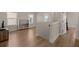 Second-floor landing featuring hardwood flooring and views to the street from large windows at 118 Jesup Ct, Ridgeville, SC 29472