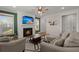 Comfortable living room with a fireplace, large windows, and stylish furniture, perfect for relaxation at 118 Jesup Ct, Ridgeville, SC 29472