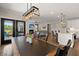 Open-concept living space with kitchen, dining area, and cozy living room with fireplace at 118 Jesup Ct, Ridgeville, SC 29472