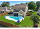 Aerial view of a backyard featuring a pool, lush lawn, patio furniture, and a privacy fence at 118 Netherfield Dr, Summerville, SC 29486
