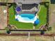 Aerial view of a backyard featuring a pool, green lawn, outdoor seating, and a privacy fence at 118 Netherfield Dr, Summerville, SC 29486