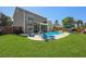 Inviting backyard with a sparkling pool, lounge chairs, and a screened patio for outdoor relaxation at 118 Netherfield Dr, Summerville, SC 29486