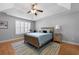Cozy bedroom features a ceiling fan, natural light, and a comfortable bed with a blue comforter at 118 Netherfield Dr, Summerville, SC 29486
