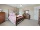 Bright bedroom with a four-poster bed, dresser, and cute animal art at 118 Netherfield Dr, Summerville, SC 29486