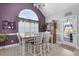 Dining area with vaulted ceilings, shutters, modern chandelier, and outdoor views at 118 Netherfield Dr, Summerville, SC 29486