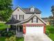 Beautiful two-story home featuring a well-kept lawn, and a brick and siding exterior at 118 Netherfield Dr, Summerville, SC 29486