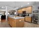 Kitchen with stainless appliances, kitchen island, and bar top eating area with neutral countertops at 118 Netherfield Dr, Summerville, SC 29486