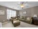 Comfortable living room with a ceiling fan, lots of light, a leather sofa, and accent chair at 118 Netherfield Dr, Summerville, SC 29486