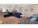 Open-concept living room with hardwood floors, comfortable seating, and staircase access at 118 Netherfield Dr, Summerville, SC 29486