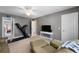 Living room features a television, sofa, and an exercise machine at 118 Netherfield Dr, Summerville, SC 29486