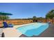 Inviting swimming pool with lounge chairs and a privacy fence, perfect for outdoor relaxation at 118 Netherfield Dr, Summerville, SC 29486