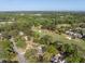 Expansive aerial view of a golf course community with lush greenery and well-maintained homes under a clear blue sky at 1183 Farm Quarter Rd, Mount Pleasant, SC 29464