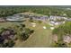 Aerial view showcasing the community's golf course, tennis courts, and surrounding landscape, with a glimpse of the clubhouse at 1183 Farm Quarter Rd, Mount Pleasant, SC 29464