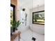 Chic bathroom with frameless shower, soaking tub, and black fixtures at 1183 Farm Quarter Rd, Mount Pleasant, SC 29464