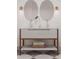 Double vanity with shelving and round mirrors in a modern bathroom at 1183 Farm Quarter Rd, Mount Pleasant, SC 29464